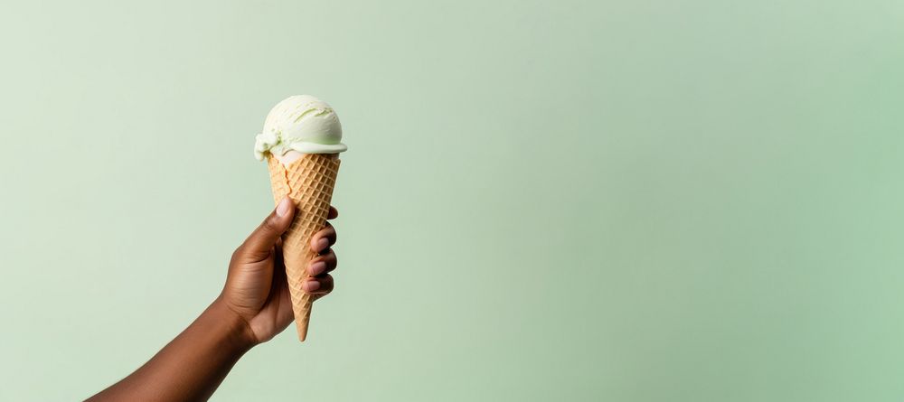 Dessert holding cream food. AI generated Image by rawpixel.