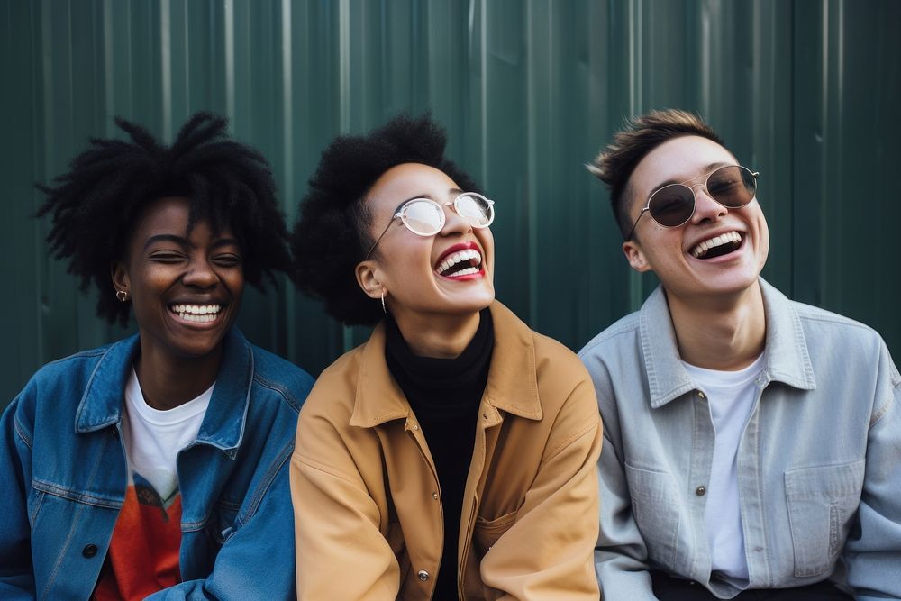 3 women laughing outdoors