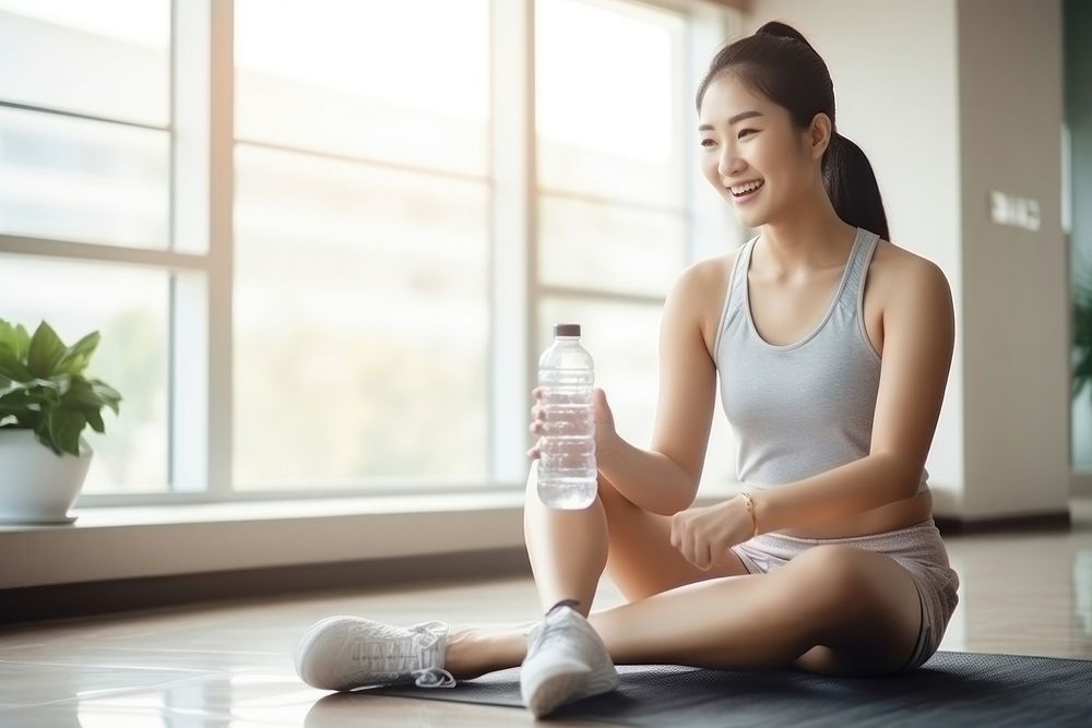 Sitting sports bottle adult. AI generated Image by rawpixel.