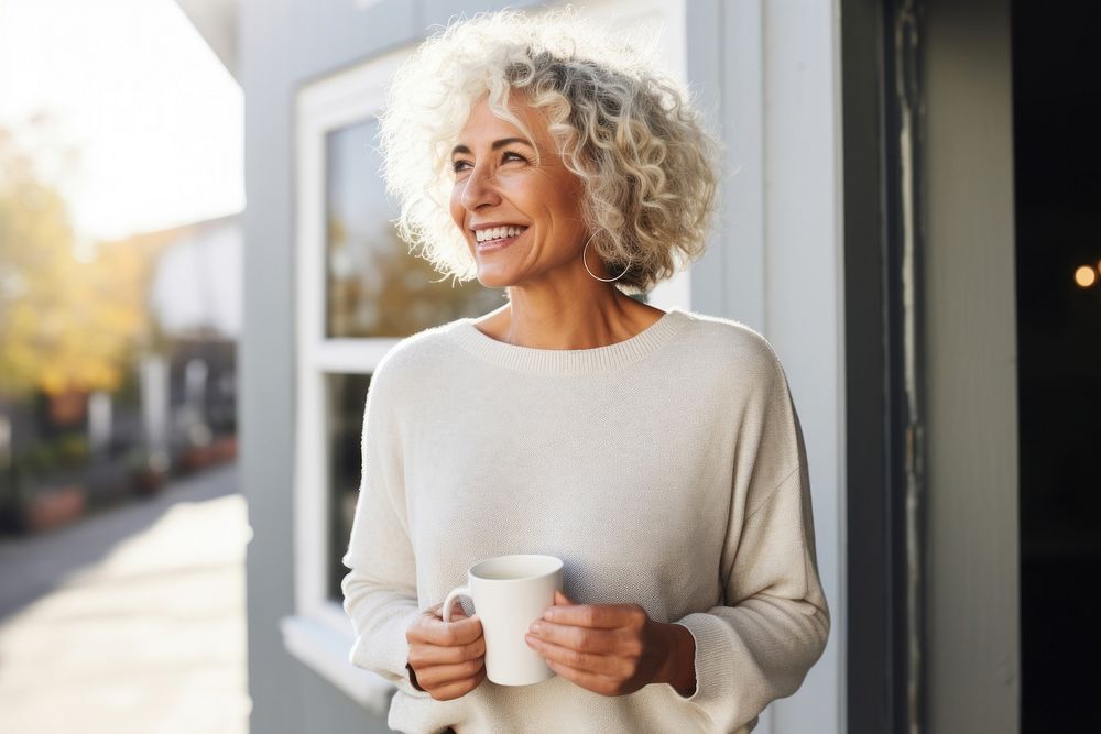 Cup sweater holding coffee. 