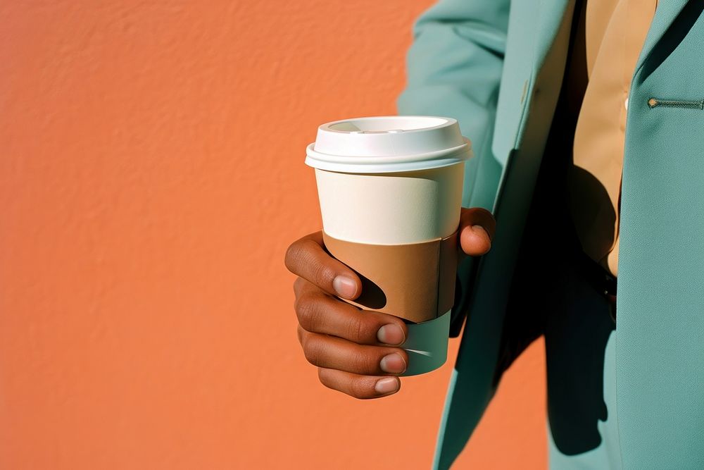 Coffee cup holding drink. 