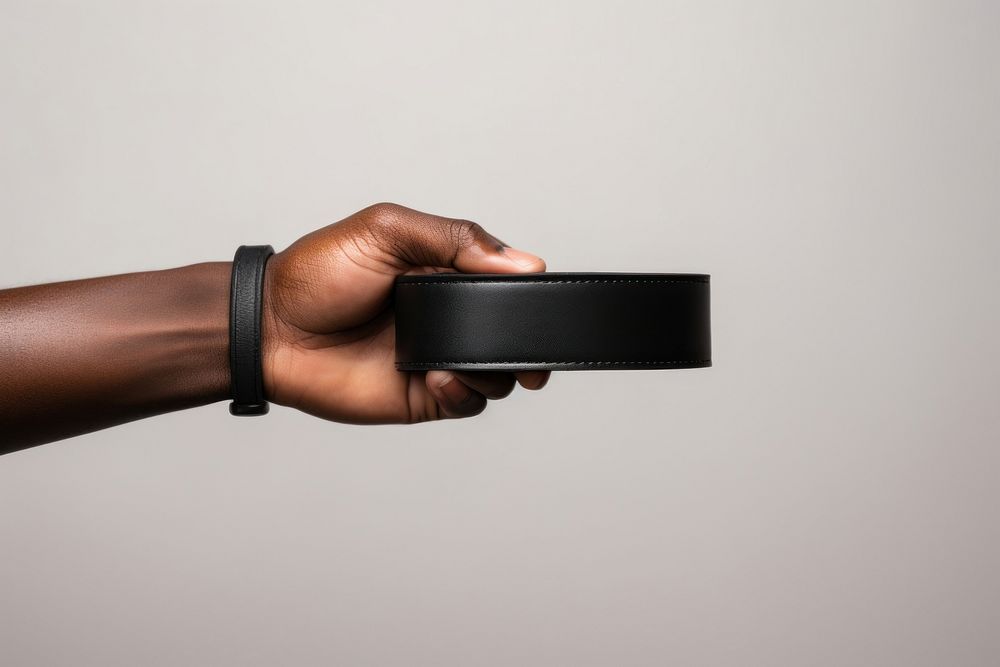 Hand holding belt accessories. AI generated Image by rawpixel.