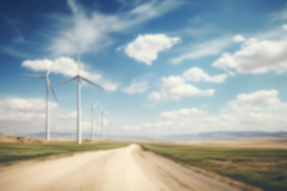 Blurred wind farm backdrop, alternative energy, natural light