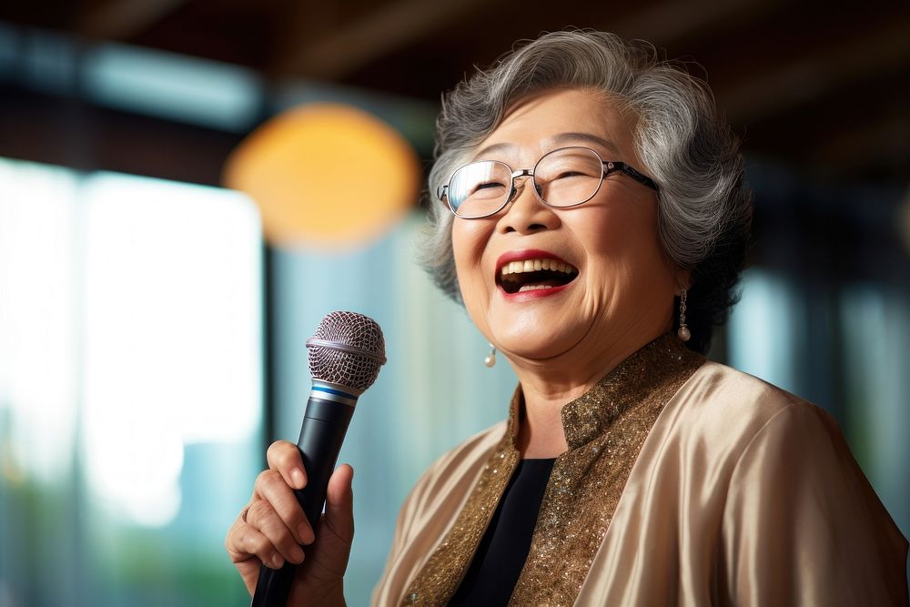 Senior microphone glasses smiling. 