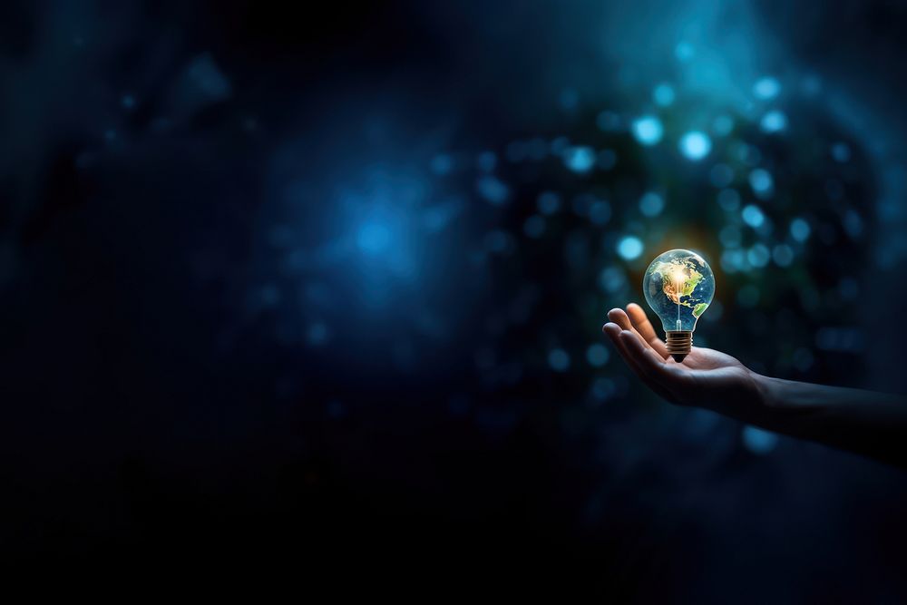 close-up remix photo of hand holding a light bulb with the earth inside. AI generated Image by rawpixel. 