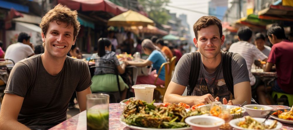 American man eating padthai food restaurant lunch. 