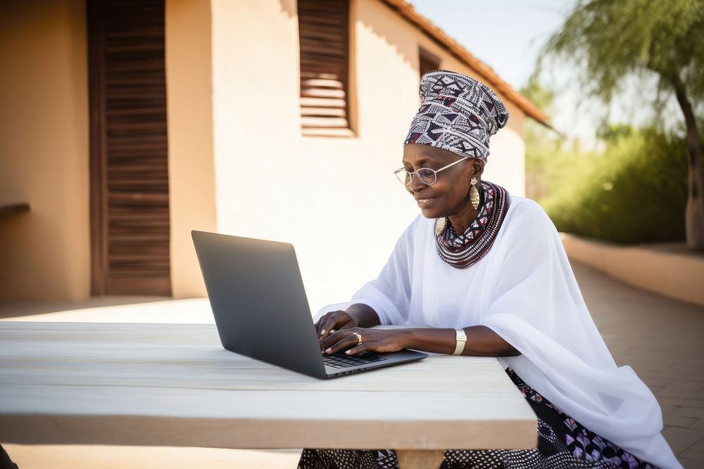Senior african woman laptop computer sitting. 