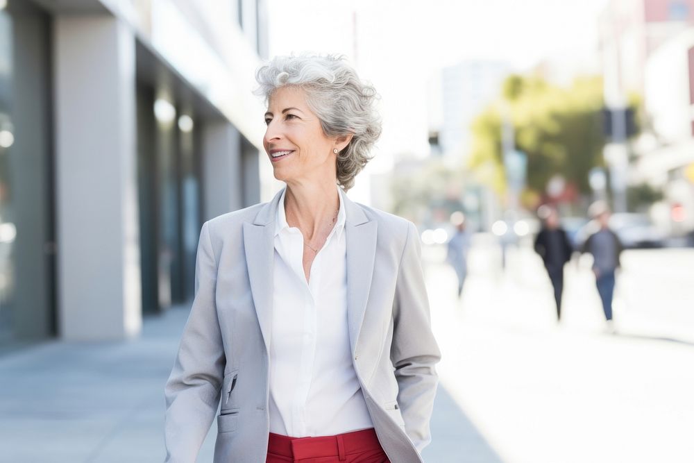 Senior business woman smile walking looking. AI generated Image by rawpixel.