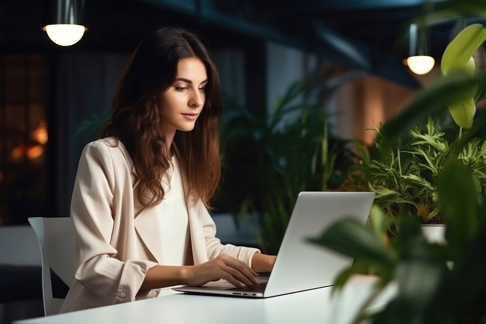 Woman laptop computer sitting. AI generated Image by rawpixel.