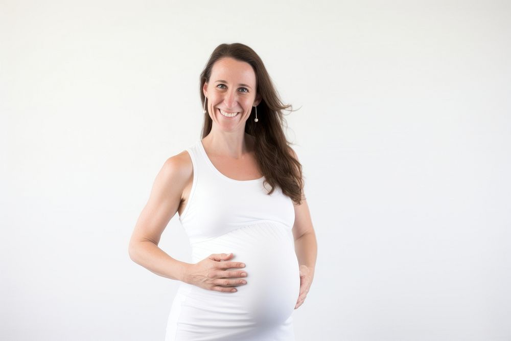 Female pregnant woman standing portrait smiling. 