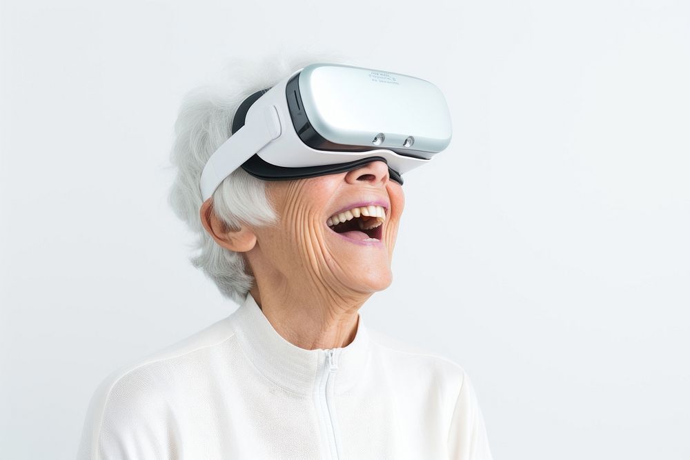 Elder Asian woman using virtual reality headset technology accessories happiness. 