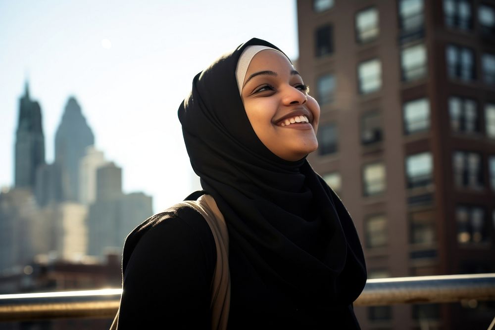 Muslim woman city portrait smiling. 