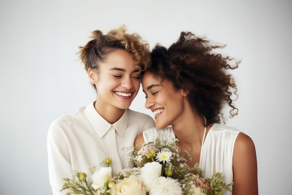 Romantic gay lesbian couple wedding laughing portrait. 