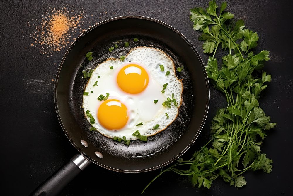 Fried egg parsley food pan. AI generated Image by rawpixel.