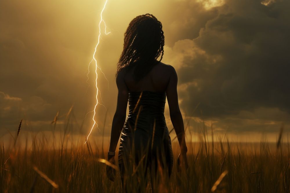 Black goddess holding a lightning bolt thunderstorm outdoors standing. AI generated Image by rawpixel.