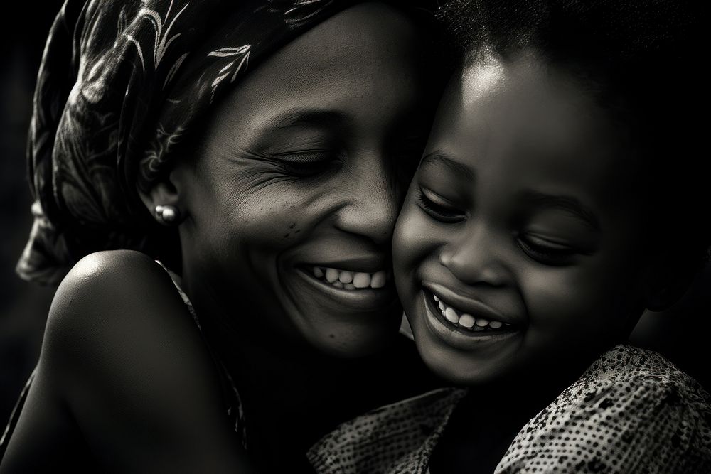 Black daughter hugging mother laughing portrait adult. 