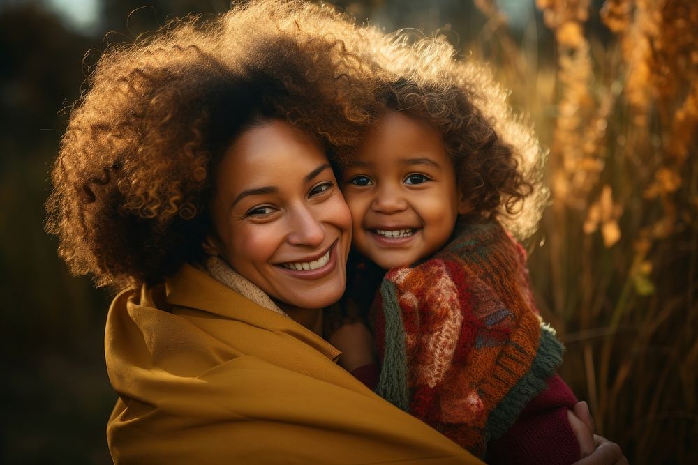 Black daughter hugging mother laughing portrait adult. 