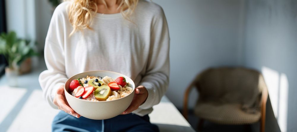 Woman eating a healthy bowl food strawberry. 
