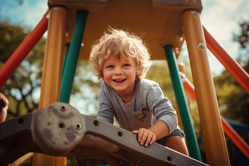 Child playing playground outdoors park. 