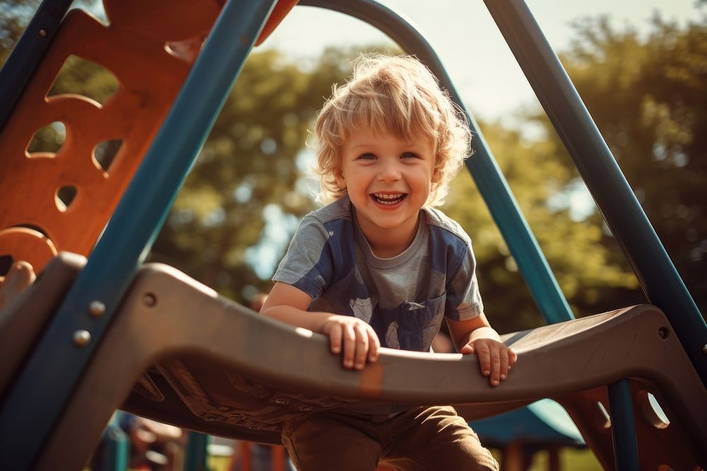 Child playing playground park outdoors. 