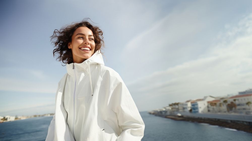 Woman wearing white jacket outdoors adult smile. AI generated Image by rawpixel.