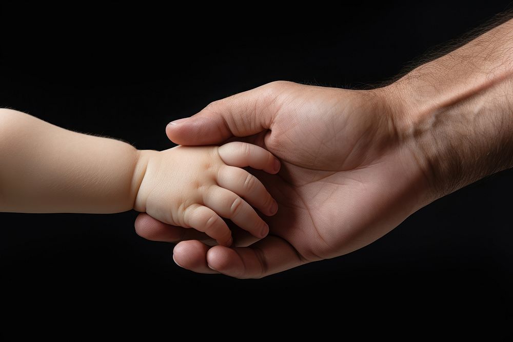 Dad hand hold baby hand finger togetherness touching. 