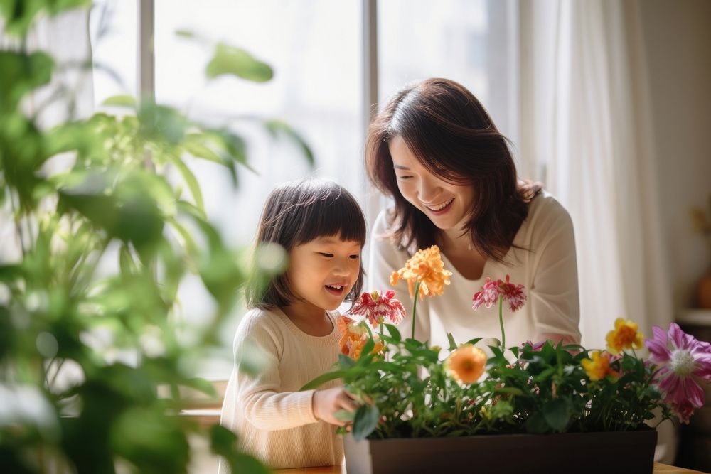 Planting flower child family adult. 