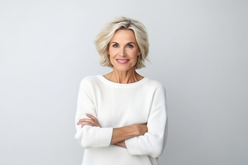 Middle age woman portrait sweater smiling. AI generated Image by rawpixel.