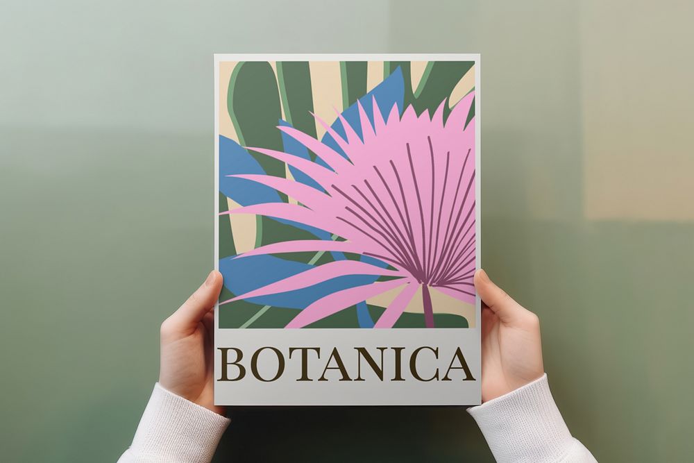 Hands holding botanical poster