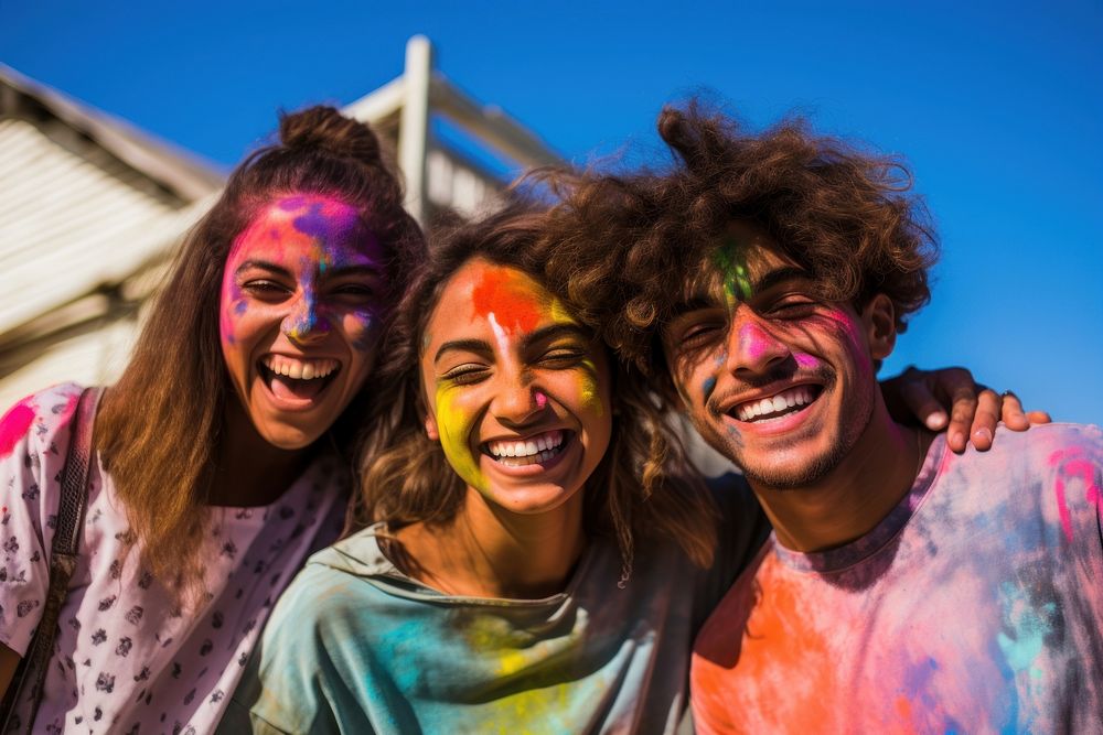 Holi festival laughing adult paint. 