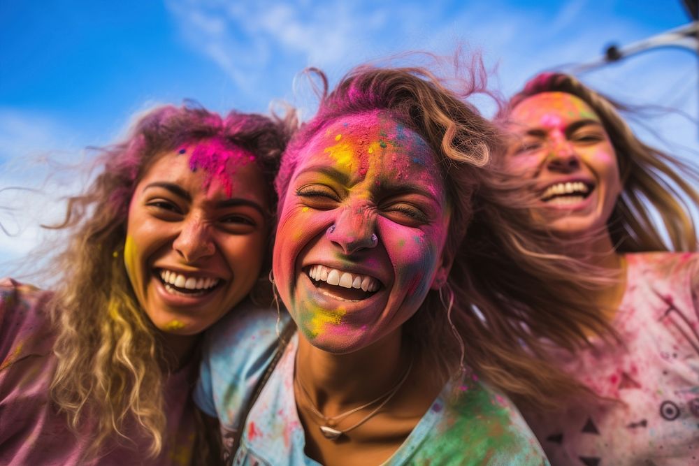 Holi festival laughing adult paint. 