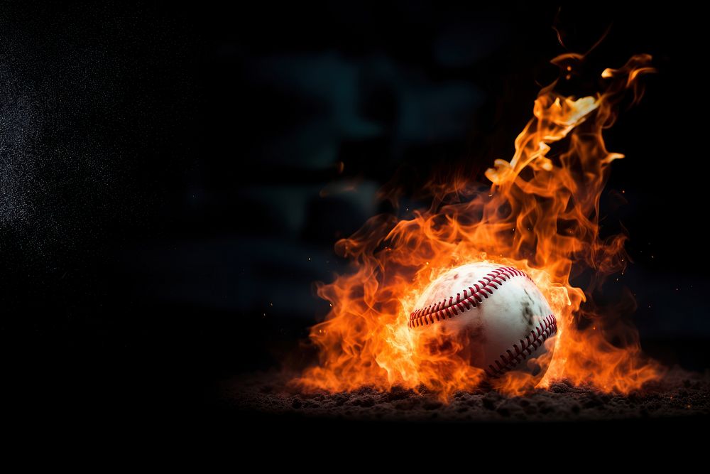 Photo of close up shot of a baseball on fire.  