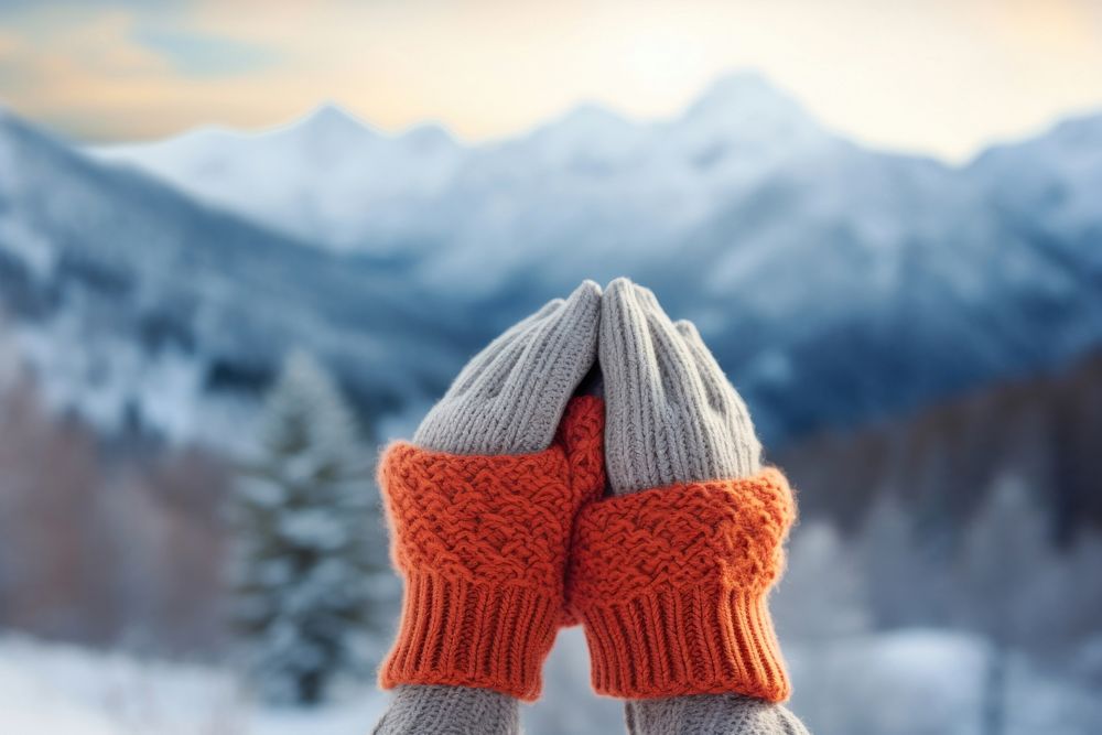 Wearing knitted gloves snow landscape outdoors. AI generated Image by rawpixel.