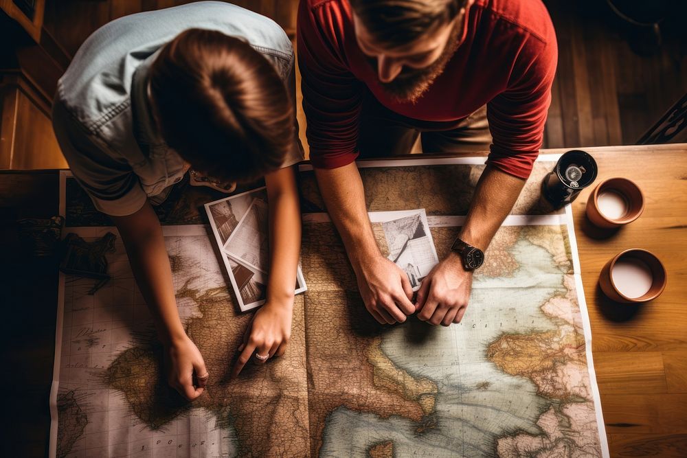 Young couple planning vacation adult table togetherness. 