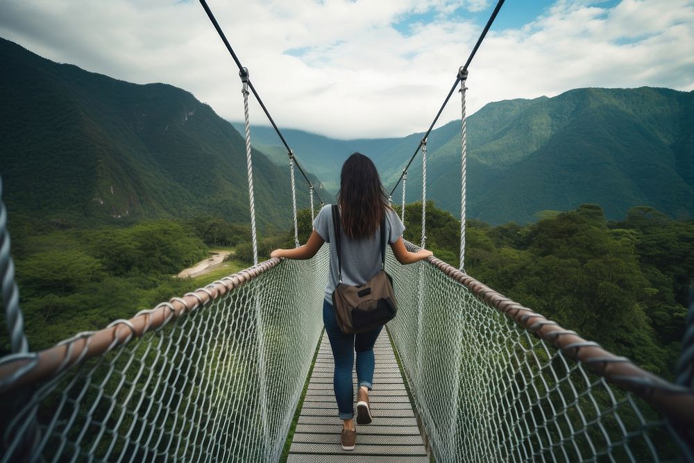 Backpacker woman walking bridge mountain. AI generated Image by rawpixel.