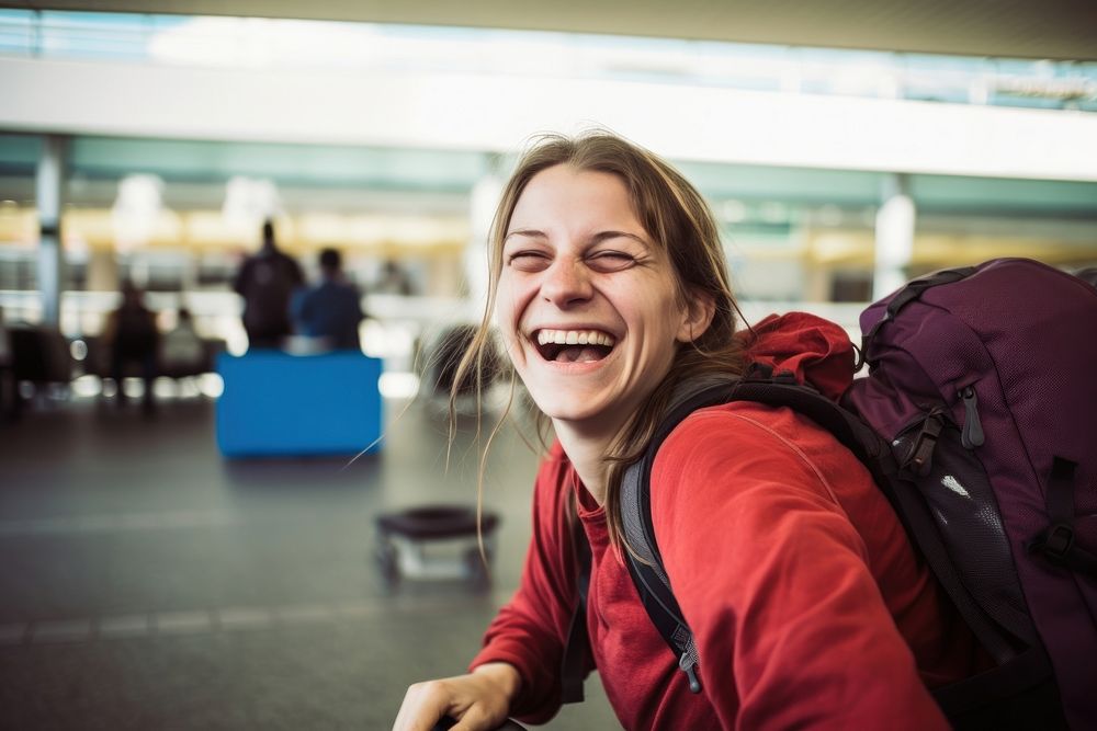 Woman backpacker laughing airport adult. AI generated Image by rawpixel.