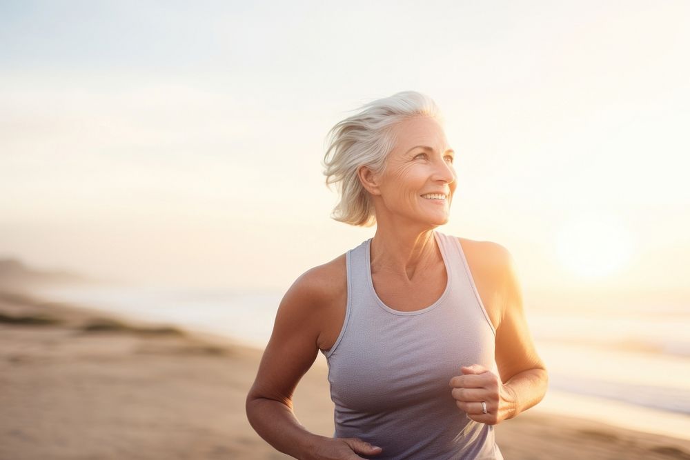 Happy athletic mature woman jogging portrait running. AI generated Image by rawpixel.