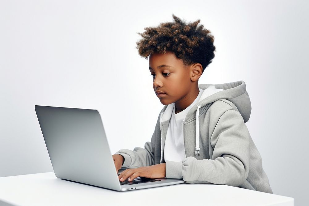 Black child student study online computer laptop sitting. AI generated Image by rawpixel.
