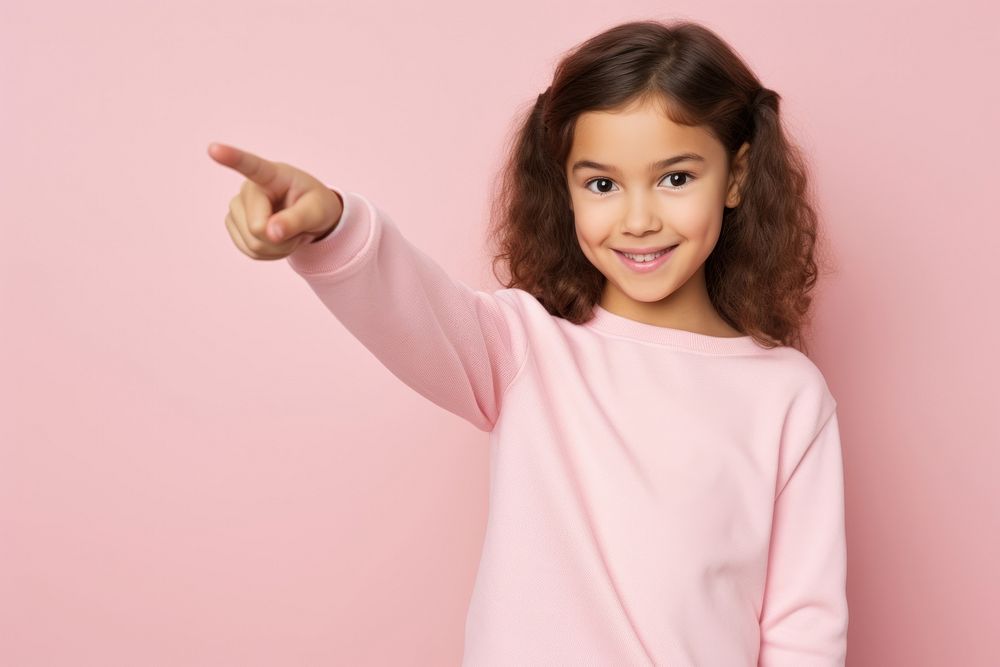 Girl pointing portrait sleeve child. AI generated Image by rawpixel.