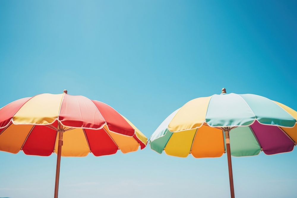 Beach umbrellas sunny sky day. AI generated Image by rawpixel.
