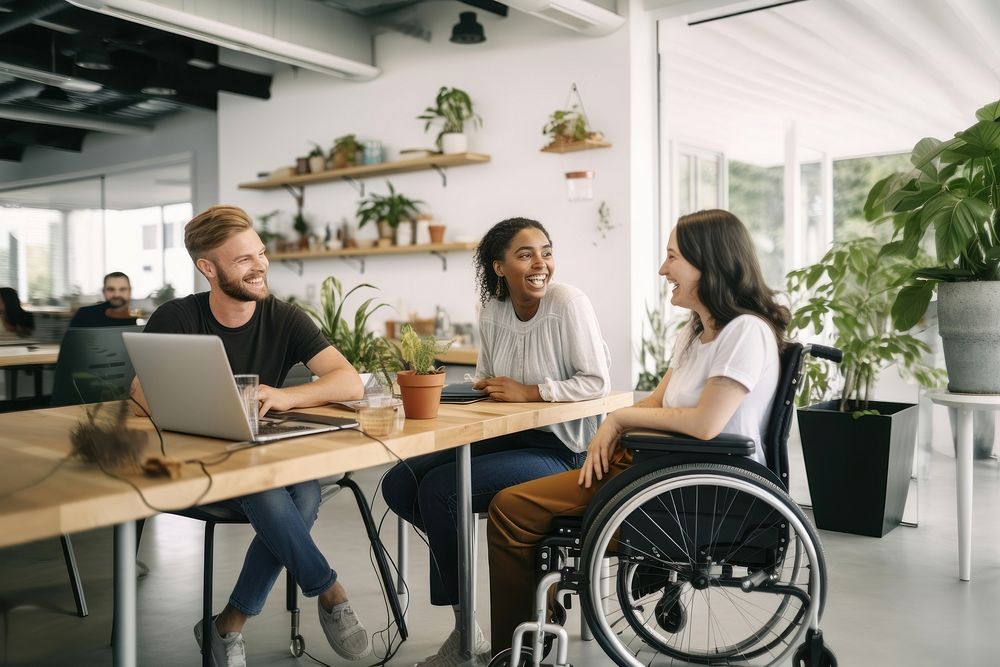 Diverse friends wheelchair computer laptop. AI generated Image by rawpixel.