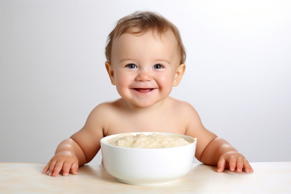 Portrait baby bowl food. AI generated Image by rawpixel.