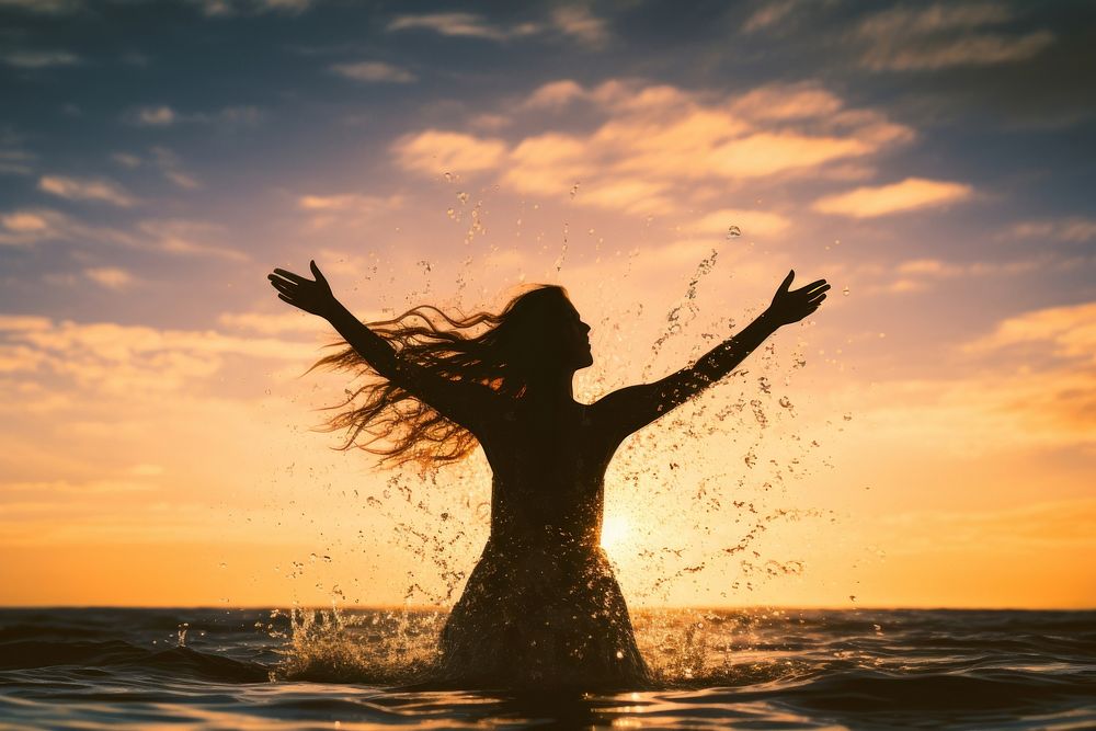 Happy woman silhouette splashing outdoors. AI generated Image by rawpixel.