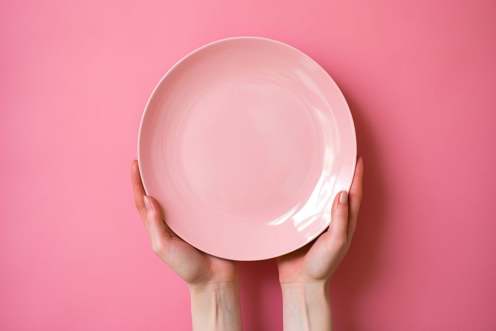 Hands holding a plate bowl pink hand. AI generated Image by rawpixel.