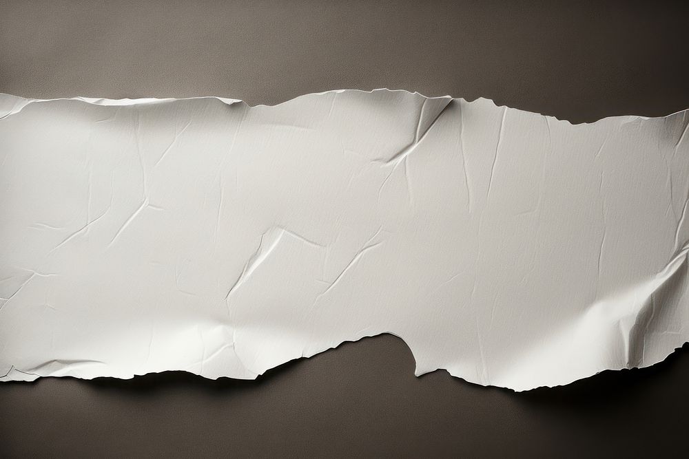 Torn strip of paper backgrounds textured crumpled.