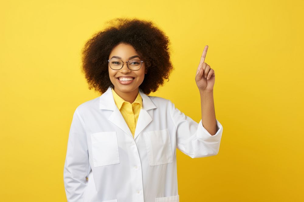 African american woman doctor smiling glasses yellow. 