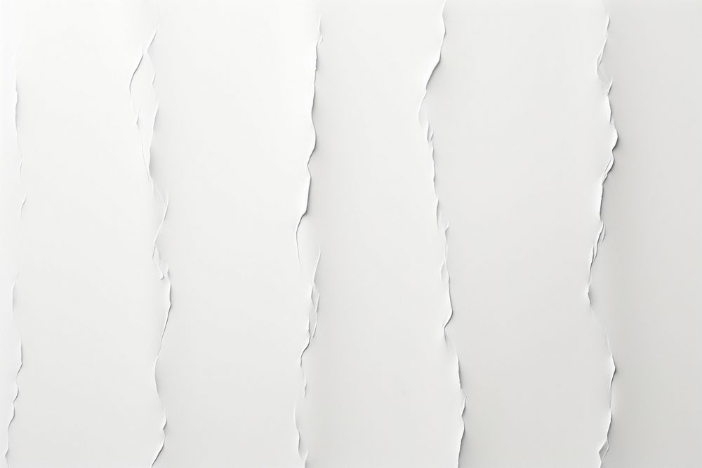 A torn strip on white paper line backgrounds textured abstract.