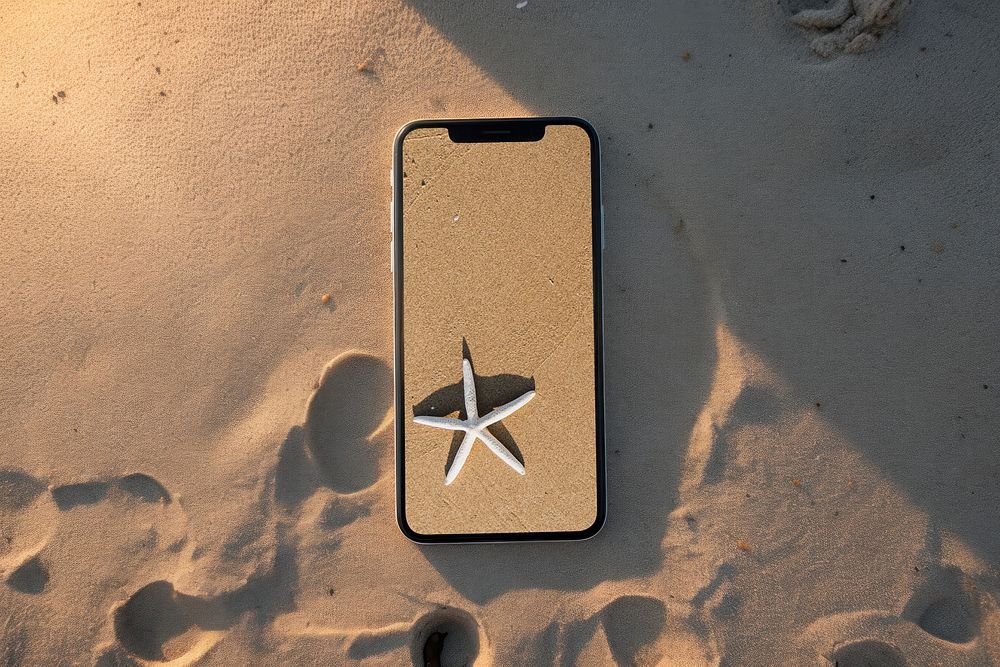 Smartphone screen with sand wallpaper