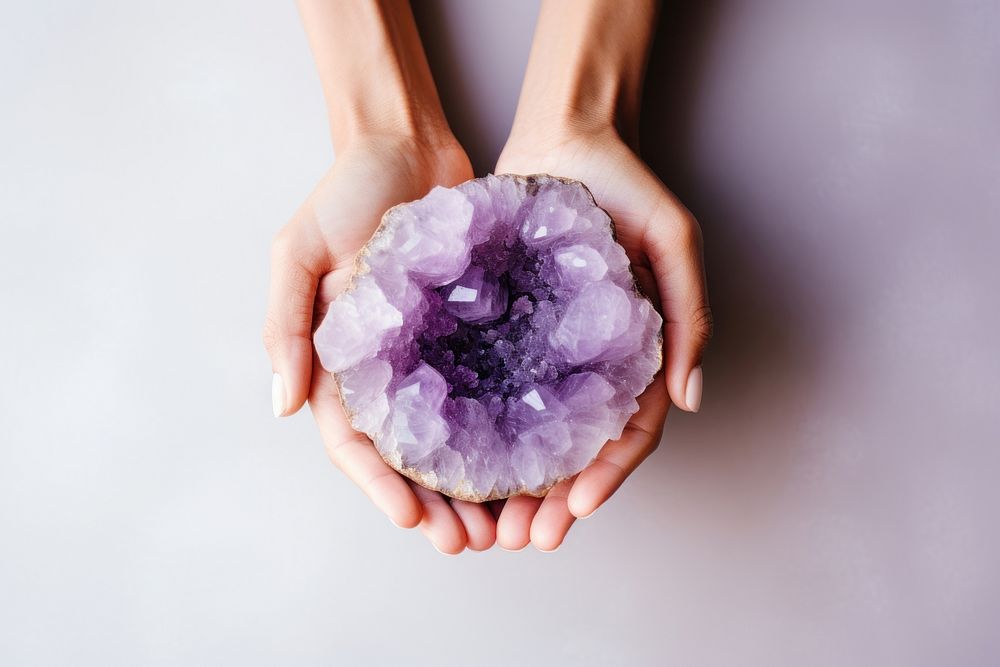 Amethyst gemstone jewelry holding. AI generated Image by rawpixel.