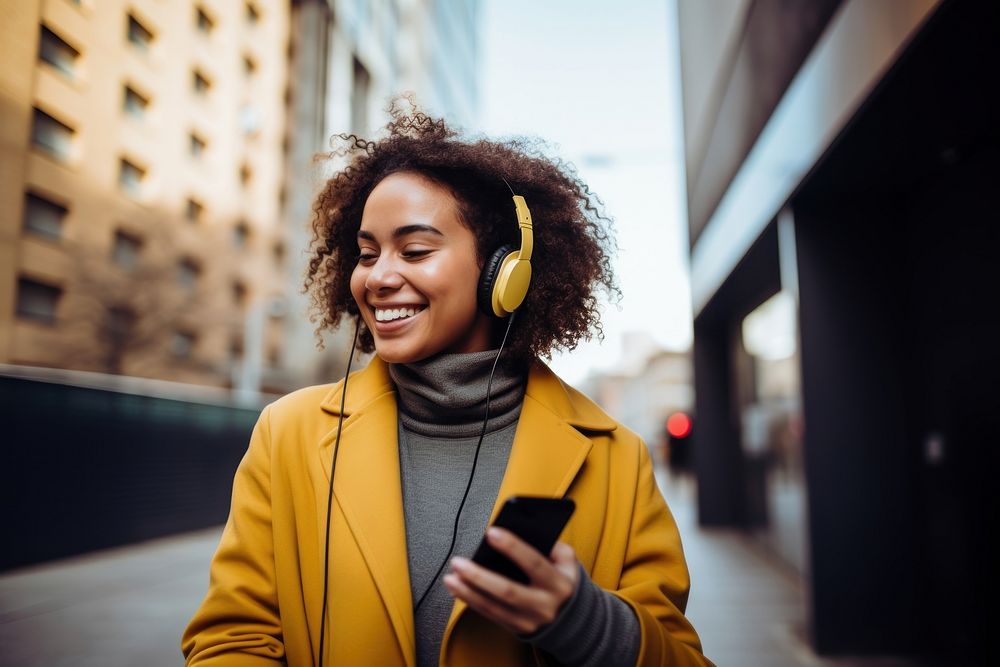 Woman holding mobile phone enjoying music headphones listening adult. AI generated Image by rawpixel.